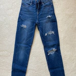 Dark-wash distressed skinny jeans